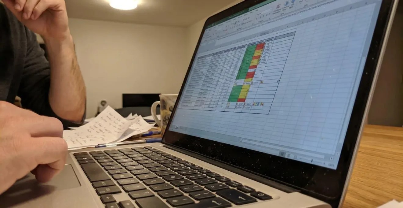 Close-up view of complex Excel spreadsheet displaying financial calculations with multiple formula references and data columns